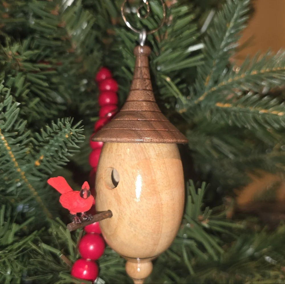 Charming Wooden Birdhouse with Red Bird Accent